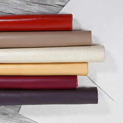 Rolled up multicolored natural leather textures samples