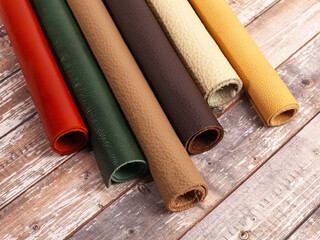 Rolled up multicolored natural leather textures samples