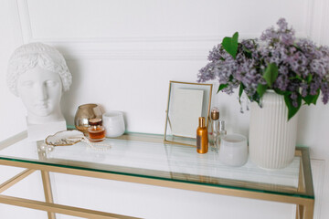 Girl’s makeup console near the white wall