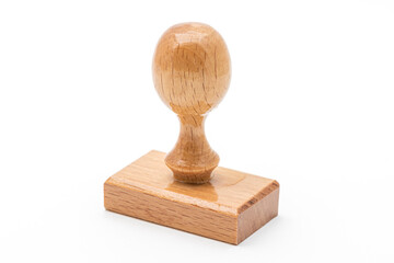 Wooden rubber stamp isolated on white background.