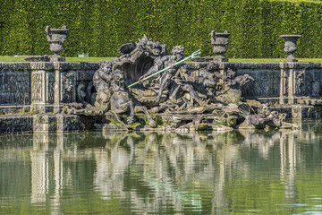 Neptune Fountain (1770) in gardens of famous Versailles palace. Palace of Versailles was a royal chateau. It added to UNESCO list of World Heritage Sites. Versailles, Paris, France. © dbrnjhrj