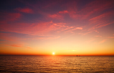 Obraz premium Spectacular romantic sunset on Mediterranean coast, clouds in colorful sky, Bar, Montenegro