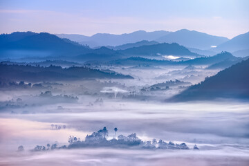 Beautiful Landscape of mountains and forest in early morning sun rays and fog near village Ngapali, Myanmar