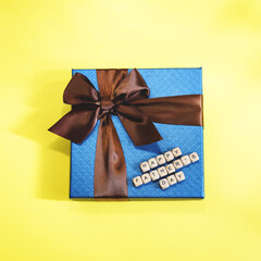 A blue gift on the yellow background.