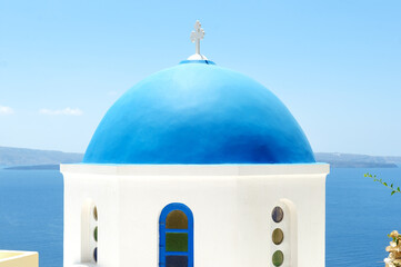 Fototapeta na wymiar Church with blue roof Santorini Oia