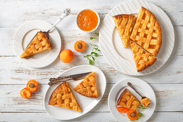 sliced apricot shortcrust pie on white plates