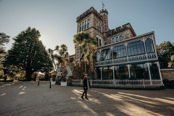 Obraz premium 30/5/2020 - Beautiful asian woman visit at Larnach Castle, Dunedin, Otago, New Zealand.