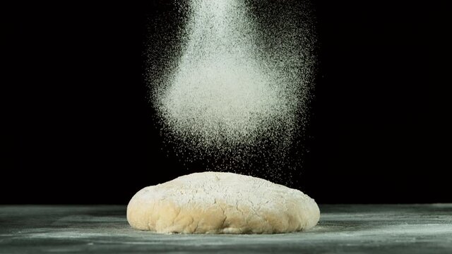 Super slow motion of falling sugar on yeast dough. Filmed on high speed cinema camera, 1000 fps.