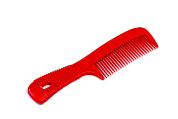 Red comb on white background with clipping path