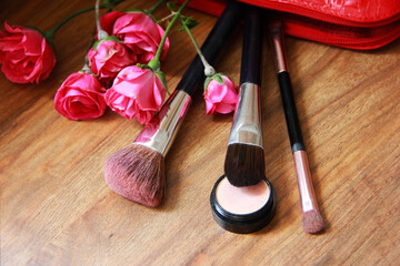 Obraz na płótnie Canvas decorative cosmetics, eye shadow, lipstick, makeup brushes