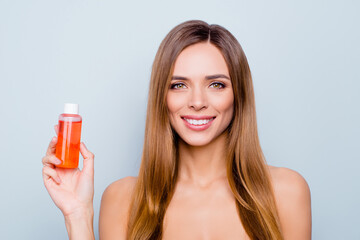 Fototapeta premium Close up photo portrait of pretty attractive brunette with perfect skin she her holding orange fruit face gel in hand use advising it naked isolated on grey background