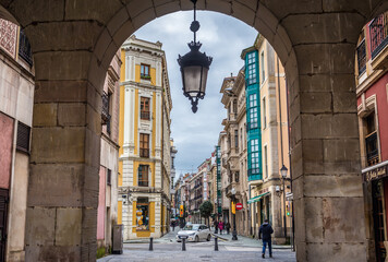 San Bernardo Street seen from Main Square of historic part of Gijon city in northwestern Spain