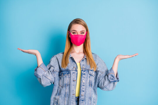 Photo Of Pretty Lady Social Distancing Not Contact People Hold Open Palms Empty Space Showing Two Variants Shopping Sales Discounts Wear Face Mask Denim Blazer Isolated Blue Color Background