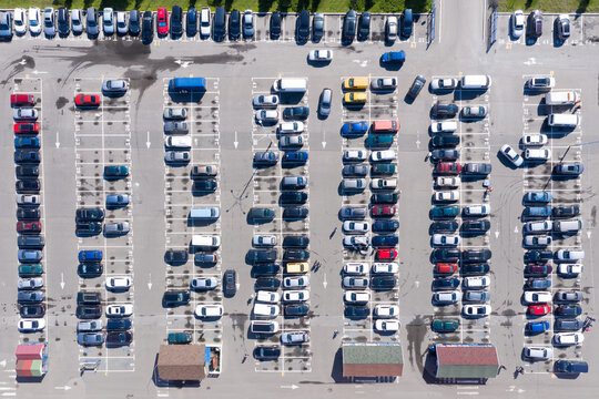 Aerial image of a top-filled car park near a shopping mall