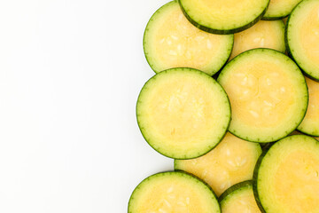 Elongated zucchini on white background