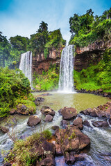 Fototapeta na wymiar Two rapid powerful waterfalls