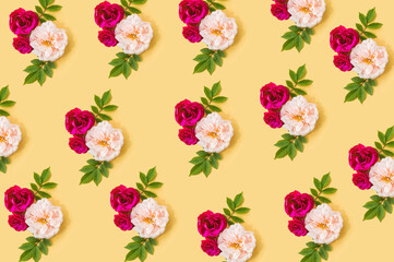 Flowers composition. Pattern made of pink flowers on yellow background. Valentines day, mothers day, womens day concept.
