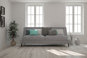 Fototapeta premium White stylish minimalist room with sofa. Scandinavian interior design. 3D illustration