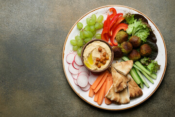 Festive dinner table with hummus plate and appetizers. Meze party food. Top view, flat lay