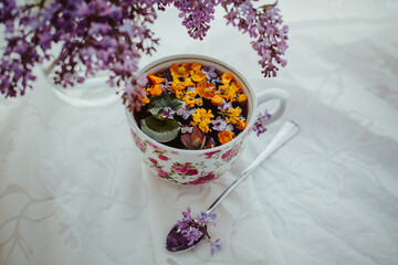 bouquet of flowers and mug of tea
