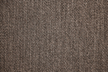 Fototapeta na wymiar Gray dark uniform background resembling pebbles or small pebbles. Solid color wallpaper. Fine abstract texture. Simple background pattern. Monotonous surface of the walls.