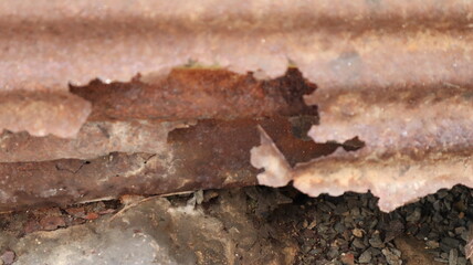 Rusting on zinc sheets exposed to sunlight and rain for a long time