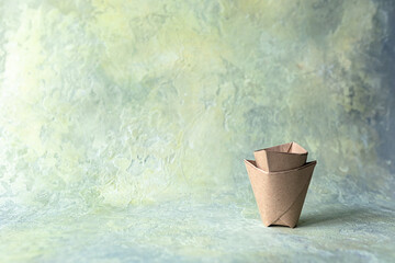 Paper cups or origami bags, containers. Eco-friendly food packaging, on an abstract beautiful...