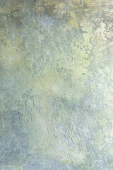 Abstract textured surface. Beautiful rich background in gray and gold colors and shades.