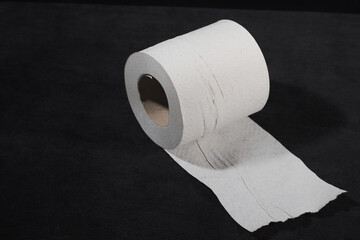 Toilet paper roll on a black background
