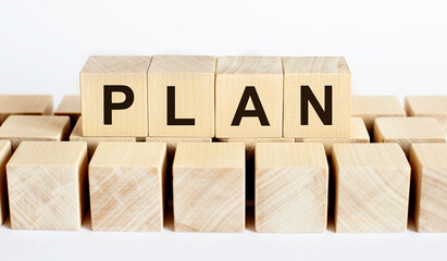 PLAN word from wooden blocks on desk, search engine optimization concept