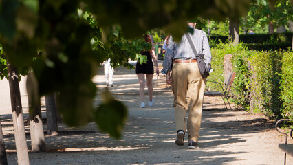 Madrid, Spain.june 02, 2020.retiree taking a nice walk in the madrid retiro park
