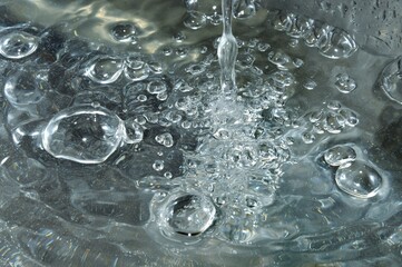 Water - falling drop, bubbles and circles on the water.