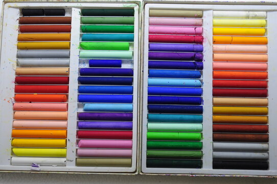 Colored oil pastels arranged in boxes,old colorful crayons, the oil pastel 