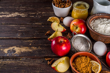 Autumn baking concept. Cooking baking background with ingredients, spices and utensils. All you need for baking traditional autumn apple pie, on rustic wooden background copy space