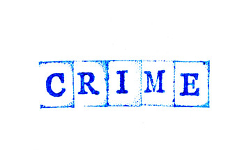 Blue ink of rubber stamp in word crime on white paper background