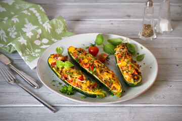 Zucchini stuffed with meat, vegetables and cheese. Zucchini boats. Loaded zucchini. Horizontal image