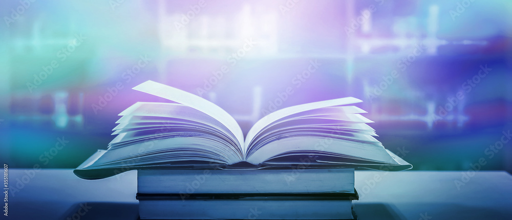 Poster stack of books in the library and blur bookshelf background