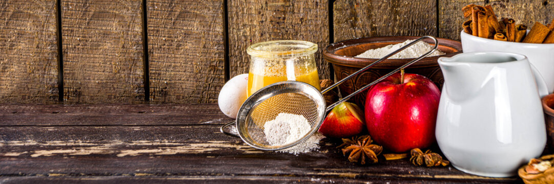 Autumn baking concept. Cooking baking background with ingredients, spices and utensils. All you need for baking traditional autumn apple pie, on rustic wooden background copy space