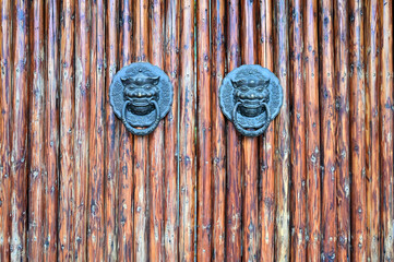 Lion door rings on wooden doors of Chinese rural folk courtyards