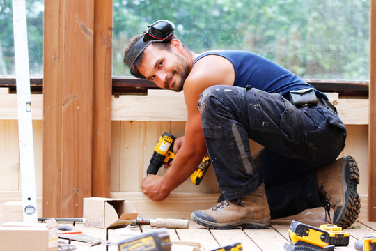Portrait of a man working as a carpenter on a construction site