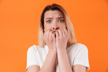 Image of stressed pretty woman expressing fright on camera