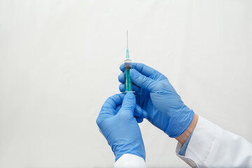 Doctor holding a medical injection syringe
