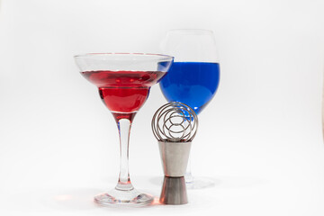 glass of red and blue wine on a white background