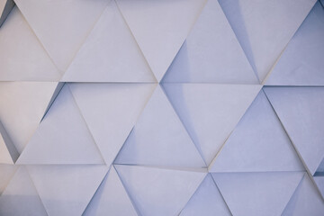 White texture with big relief triangle. light shadow. Wall.