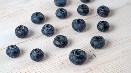 Fresh blueberries on wooden background.