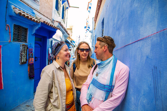 Group of tourists in the famous blue city.