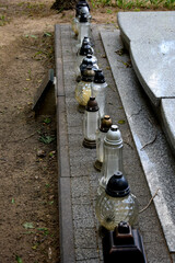 a dozen candles at the cemetery