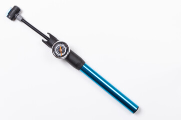 manual bicycle pump with rubber hose and pressure scale isolated on white background