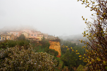 Fototapeta na wymiar fog and rain, a scenic small village in the hills of Provence