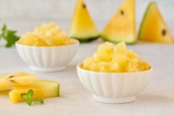Yellow watermelon granita or sorbet with mint leaves